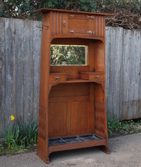 English Arts and Crafts cabinet with hand-hammered copper strap hinges, possibly Liberty.  Umbrella, coat rack, hat rack